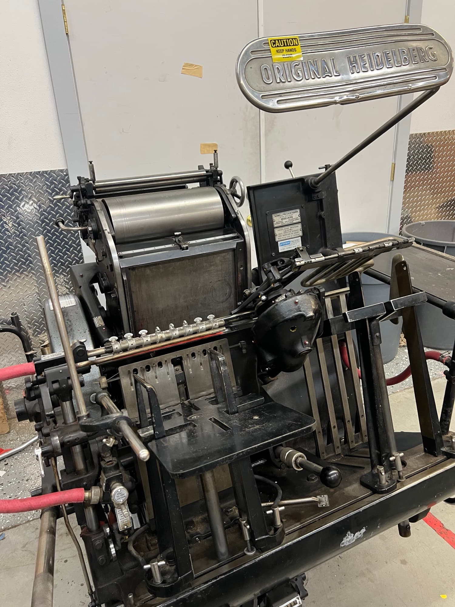 A Heidelberg Windmill platen press on the shop floor
